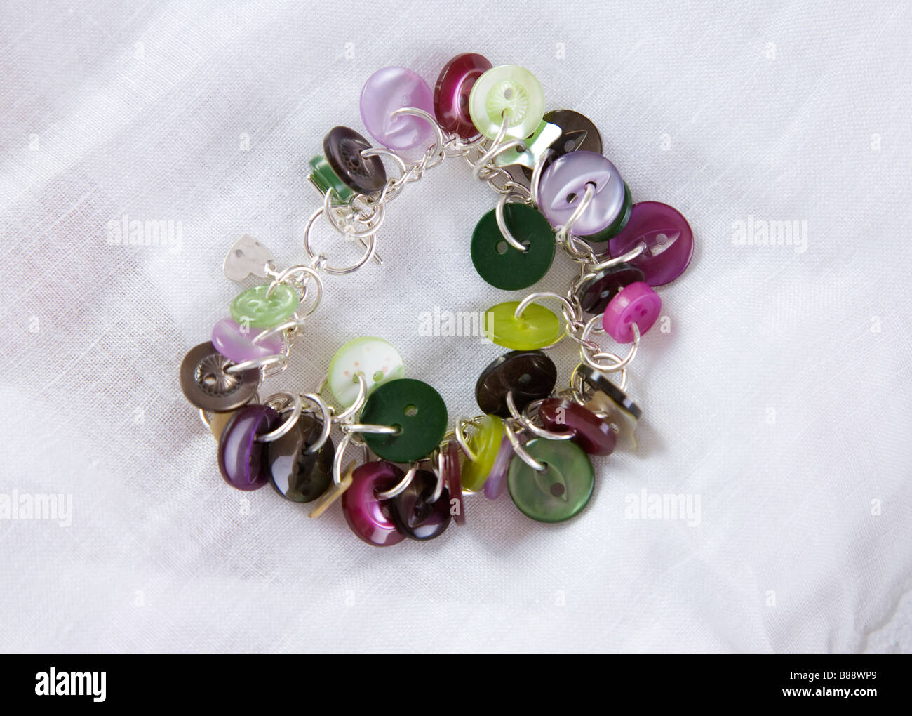 low cost jewellery made with buttons and silver plated links Stock Photo