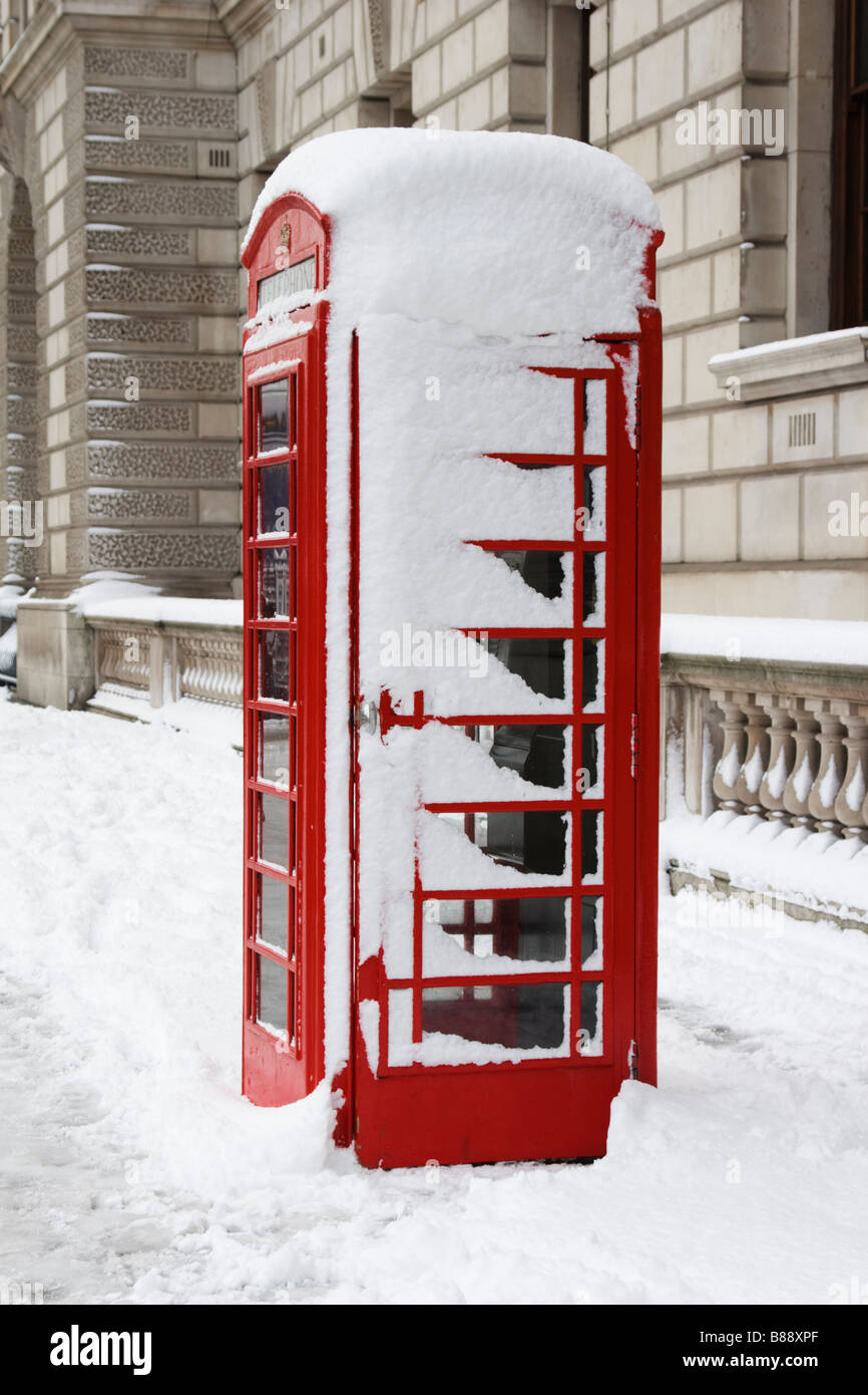 Red Phone box with snow London Stock Photo