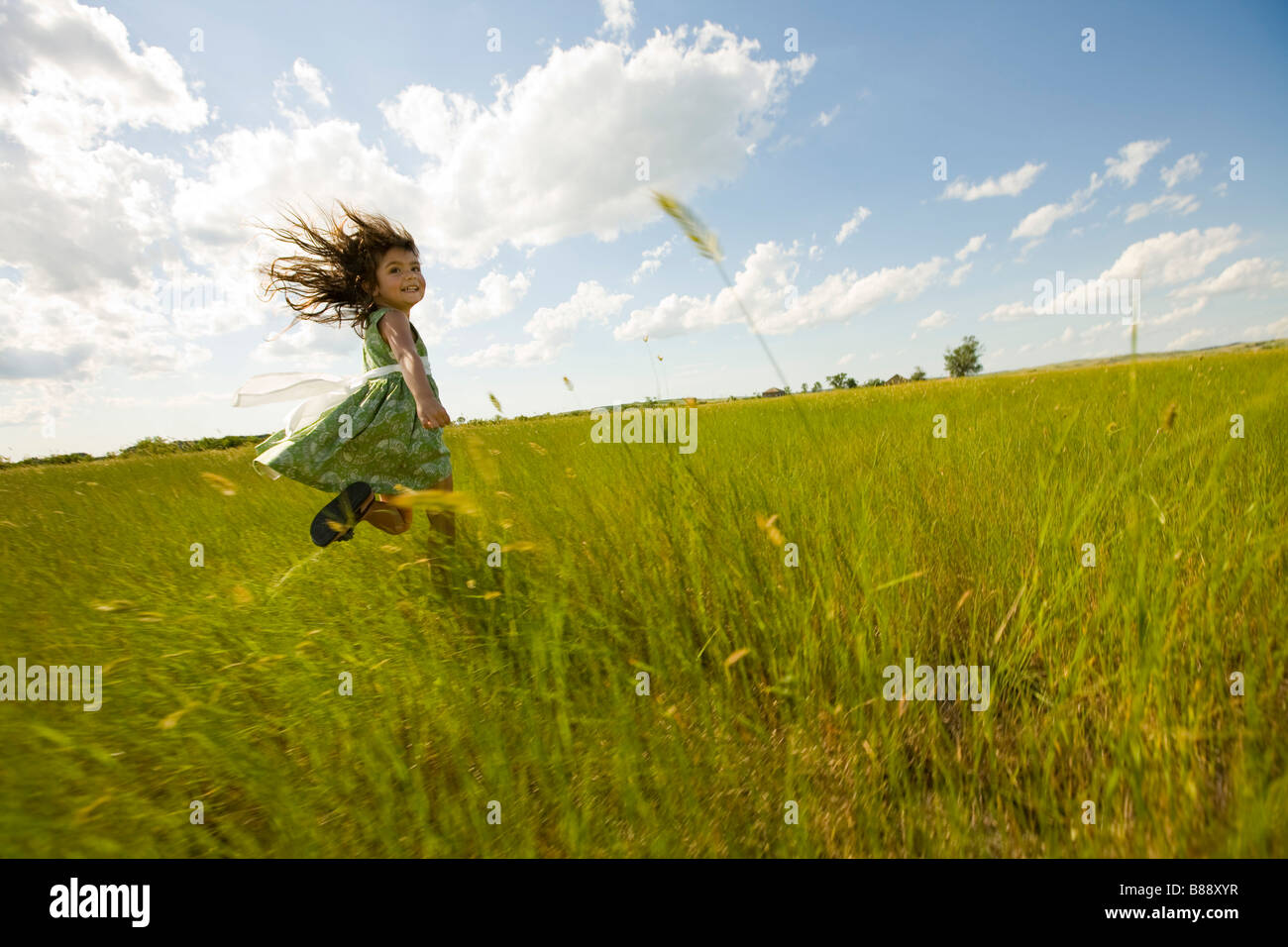Girl running through tall grass hires stock photography and images Alamy