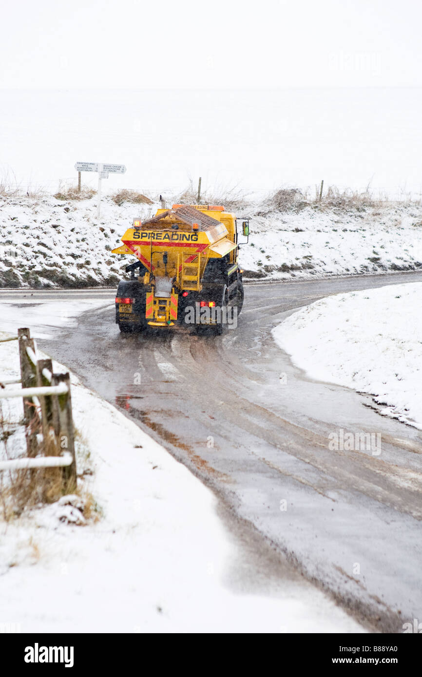 Gritting vehicle spreading in countryside Stock Photo