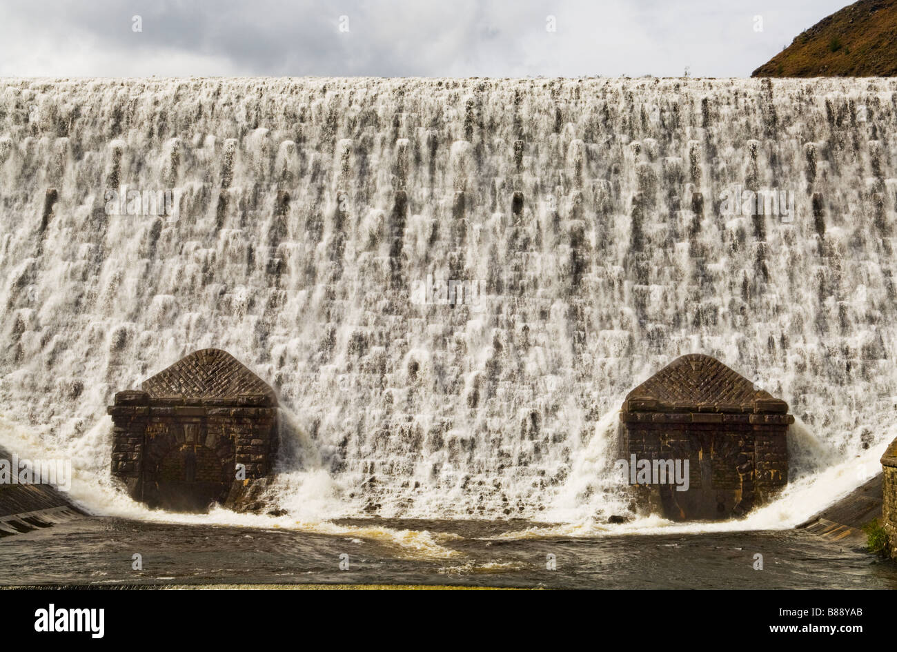 Caban Coch dam at Elan Valley, the dam closest to the visitors centre overflowing after heavy rainfall. Stock Photo