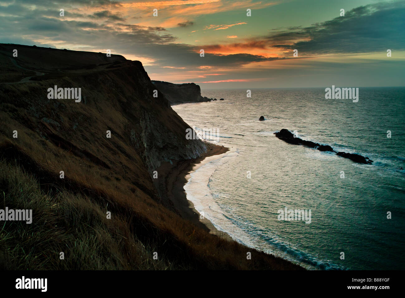 The coastline between Durdle Door and Lulworth Cove at sunrise Stock Photo