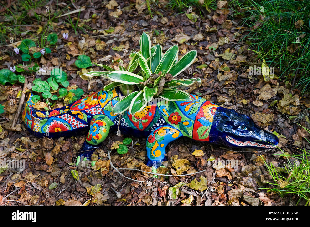 ceramic lizard with potted plant at Kanapaha Botanical Gardens