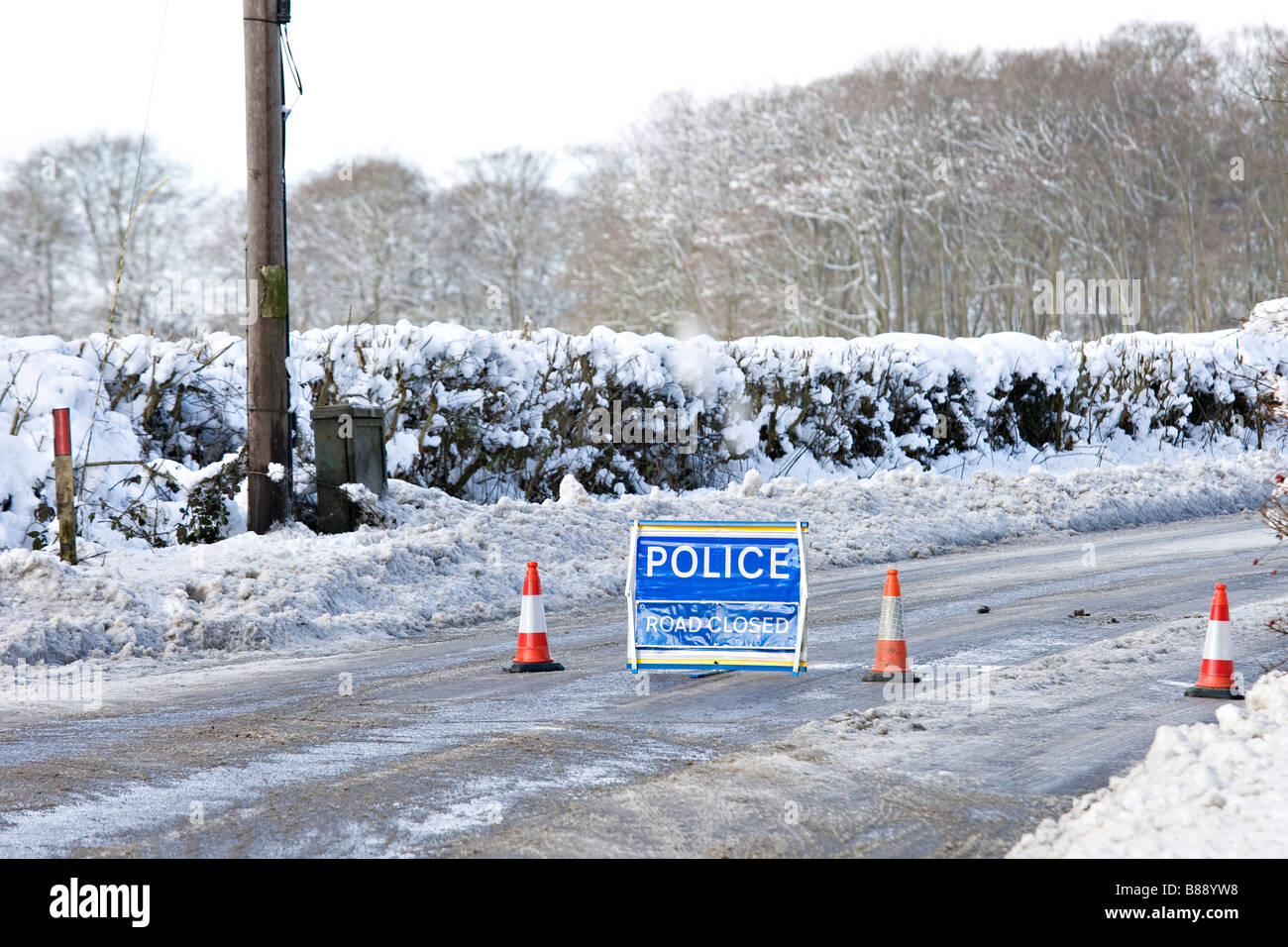 Police Road Closed Signs On Icy Country Road Stock Photo Alamy