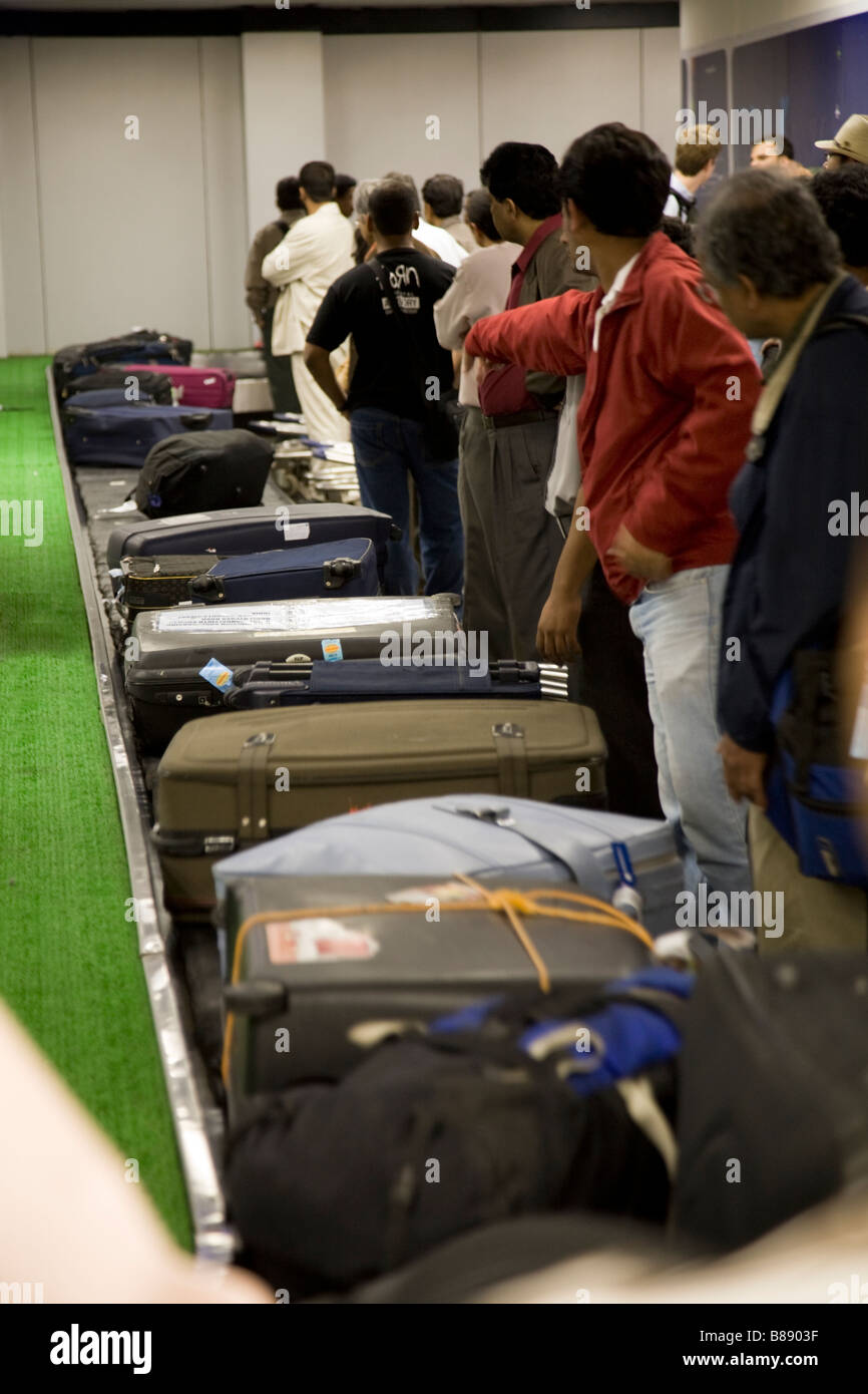 Passengers luggage baggage reclaim carousel belt in Mumbai / Bombay