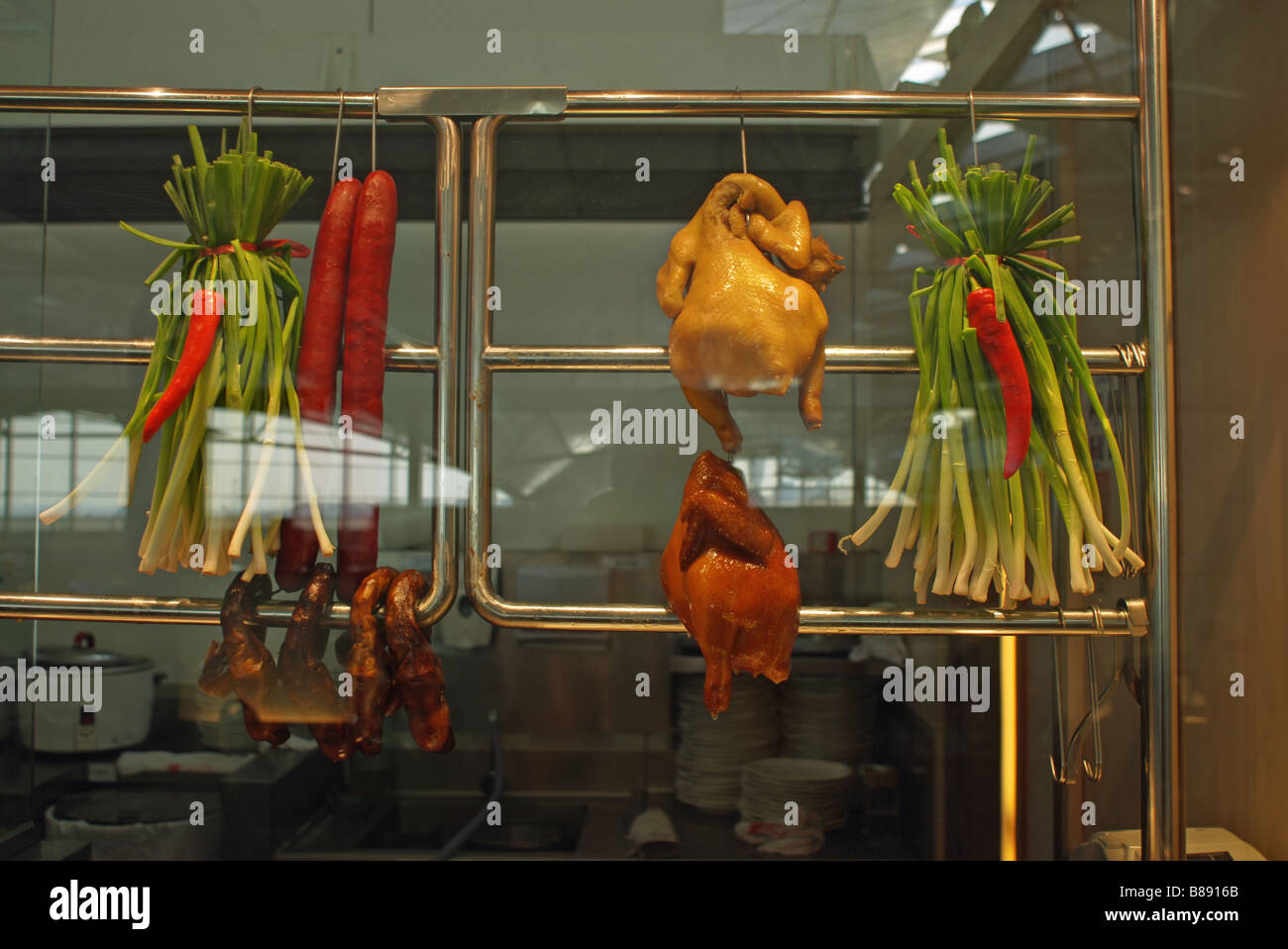 Roast chicken and duck hang in a Chinese shop window Stock Photo Alamy