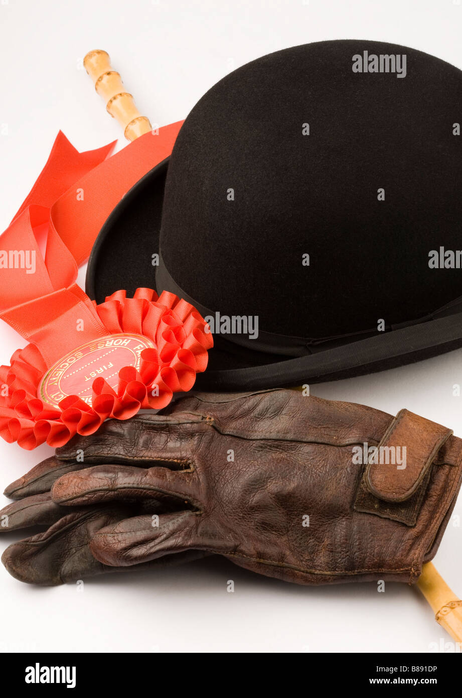 Equestrian Bowler Hat Gloves Rosette and Cane Stock Photo