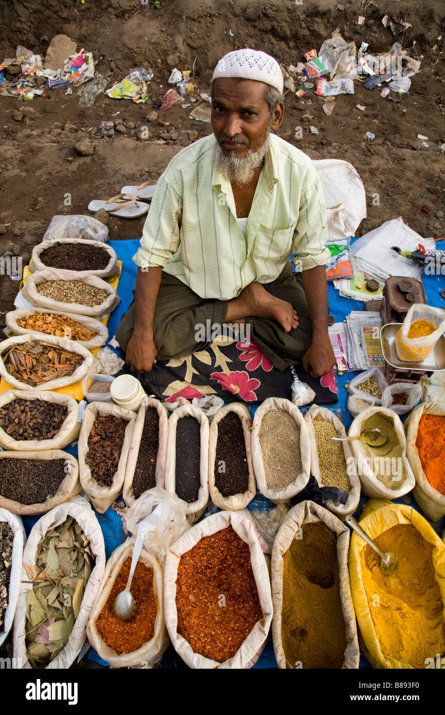 Spices for sale at a street market spice stall, with street seller