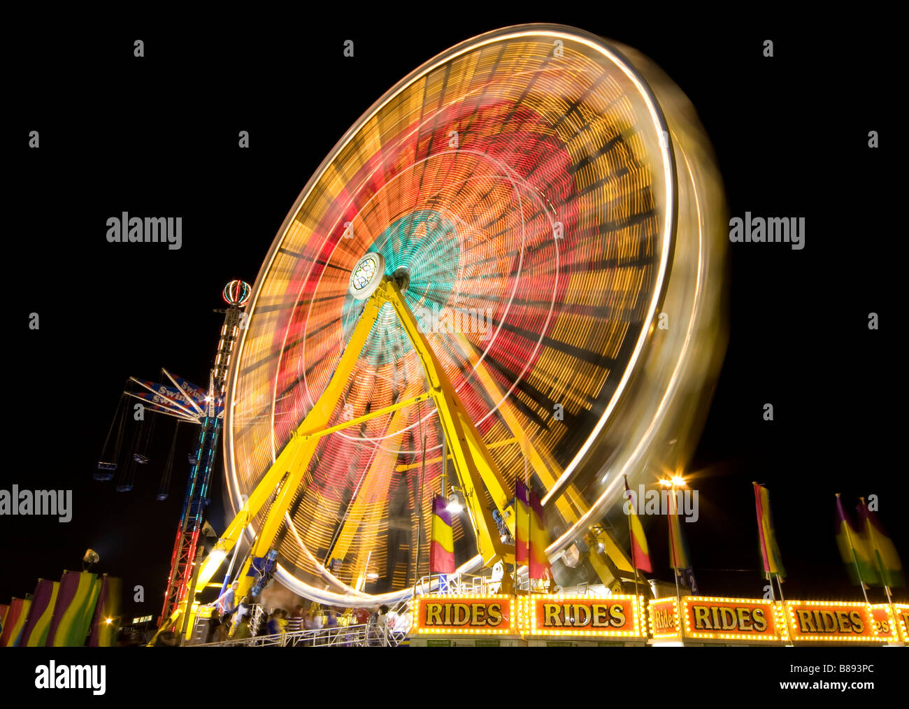 Ferris Wheel, spinning, captured with slow shutter Stock Photo