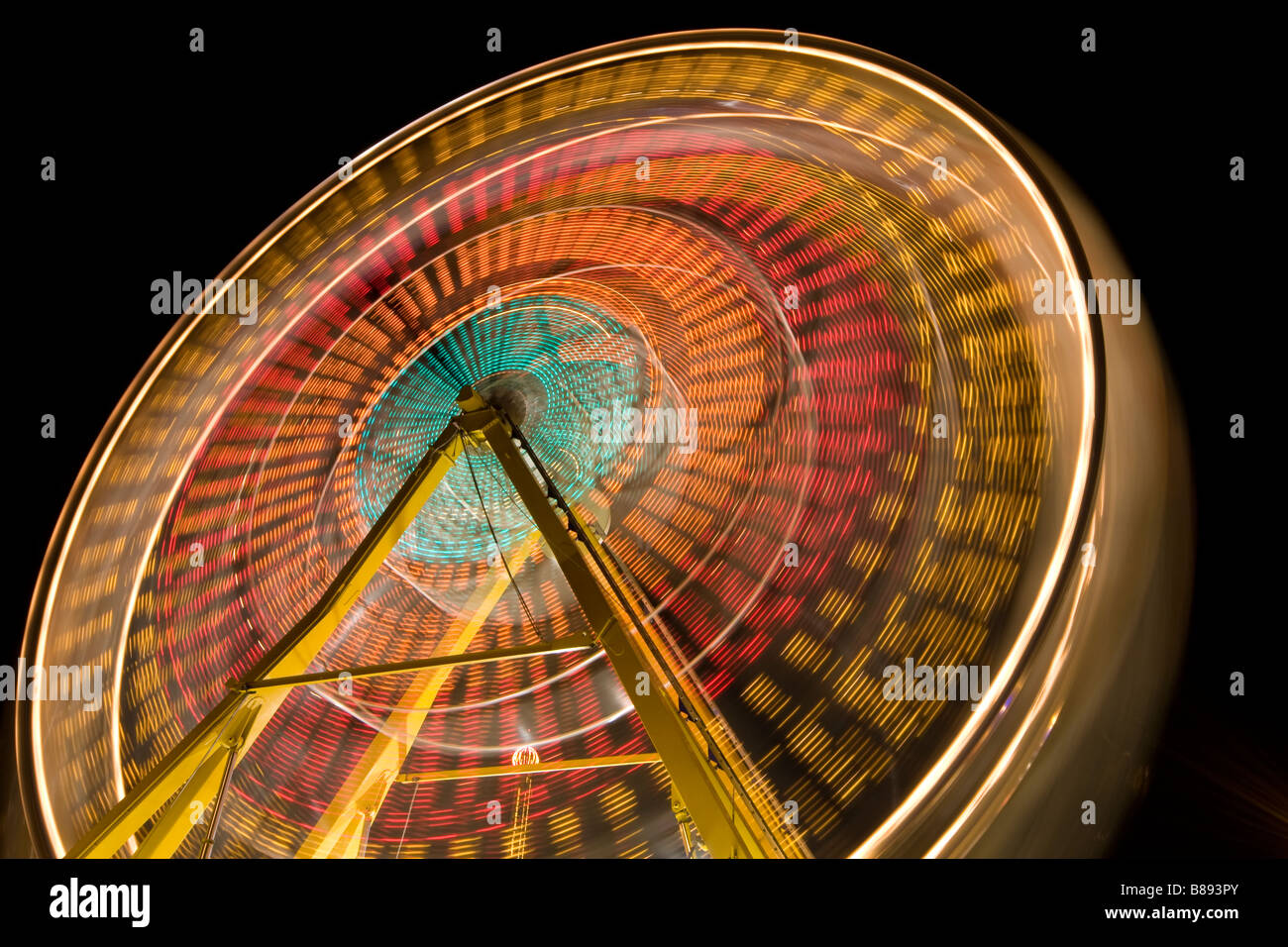 Ferris Wheel, spinning, captured with slow shutter Stock Photo