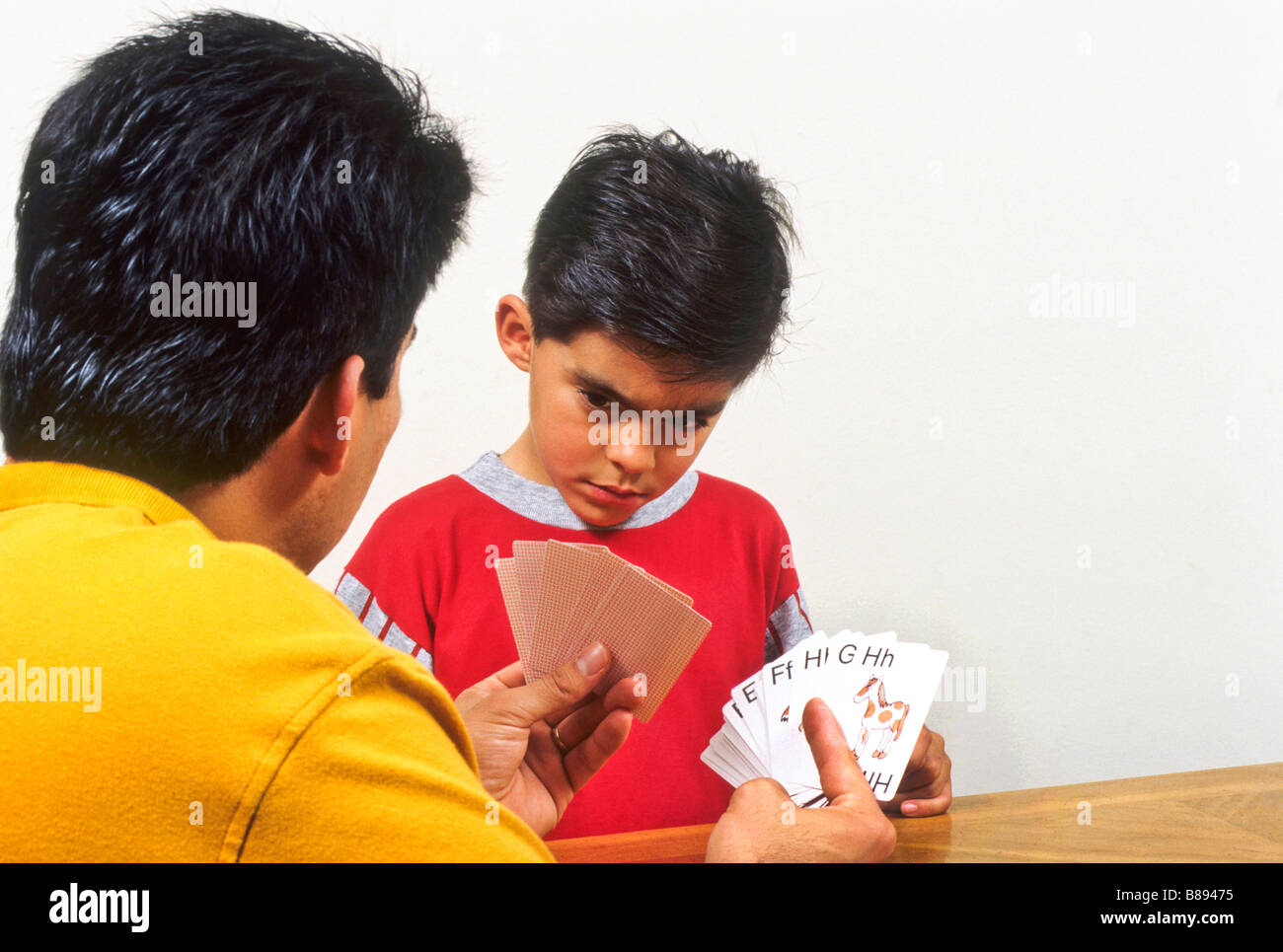 Father works with son and flash cards Stock Photo Alamy