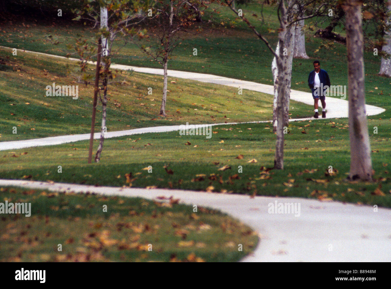 Lone man walks through hi-res stock photography and images - Alamy