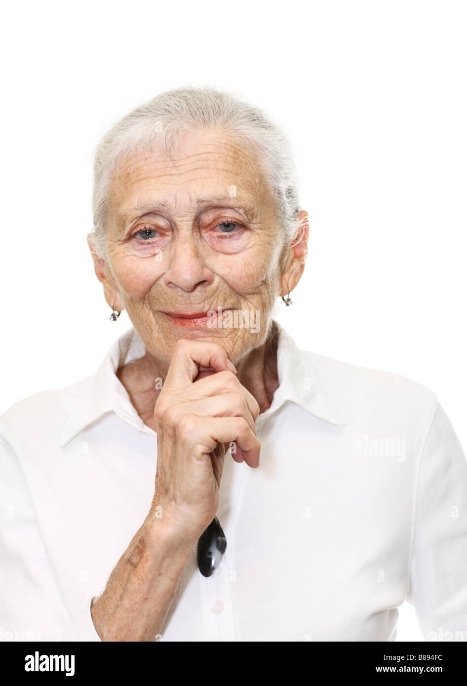 Portrait of a senior woman smiling in camera Isolated over white background Stock Photo
