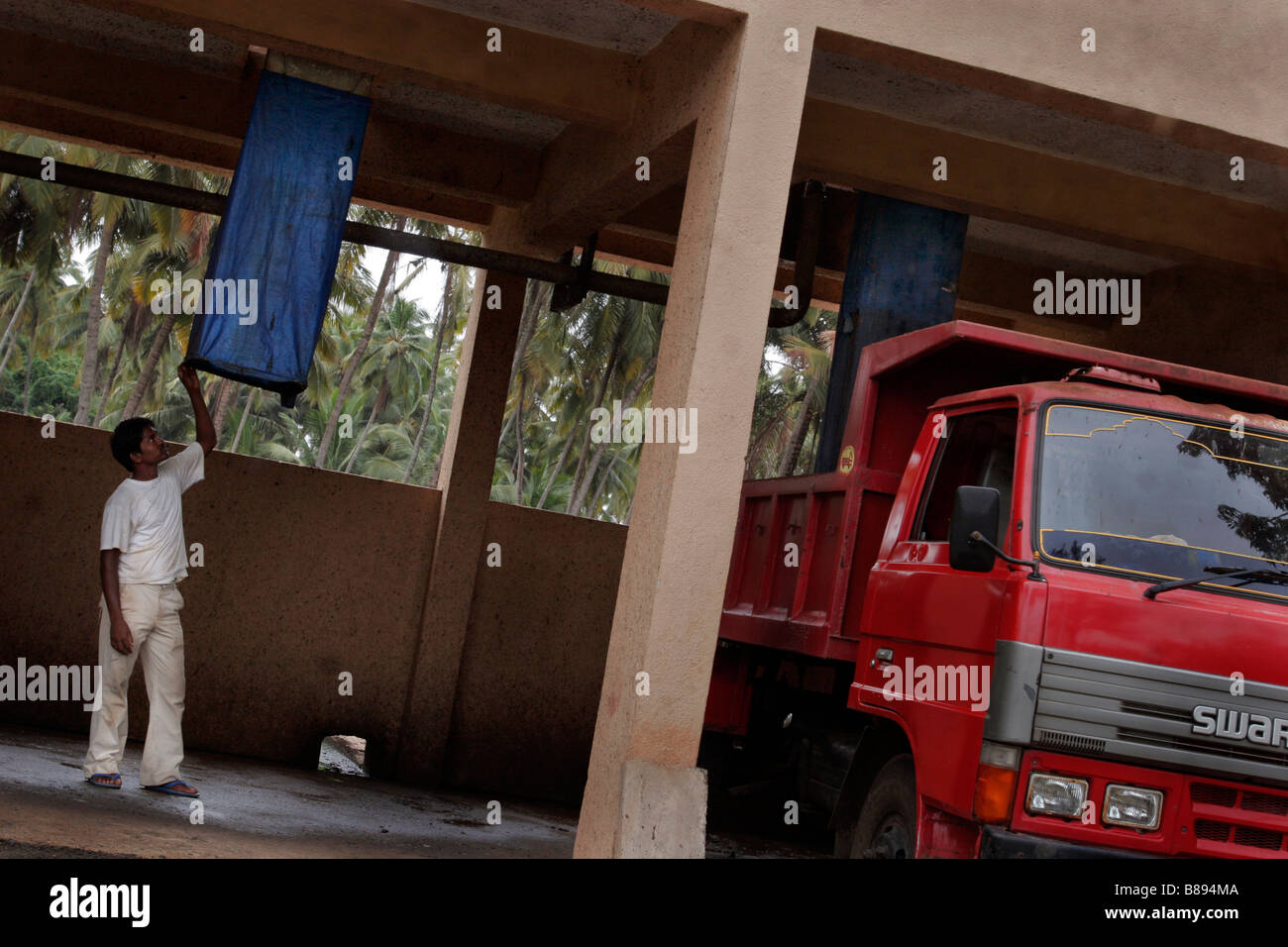 A worker checks the waste disposal system at a sewage water treatment