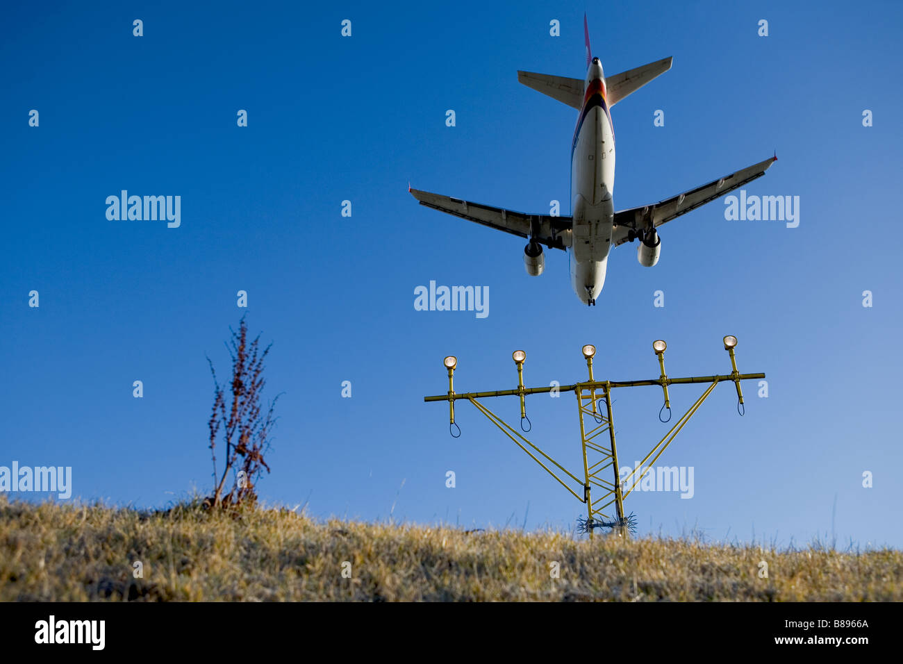 Landing airplane at sunrise hi-res stock photography and images - Alamy