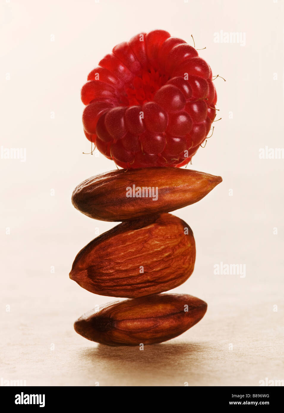A balance with almonds and raspberry Stock Photo - Alamy