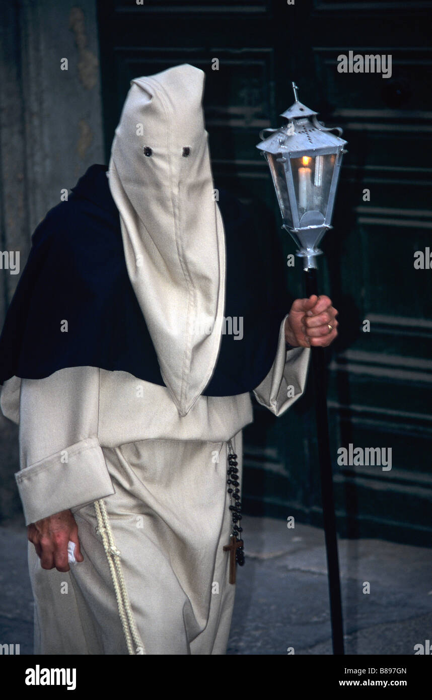 White Penitent & Lamp in Easter Parade or Holy Week Procession, Valletta, Malta Stock Photo