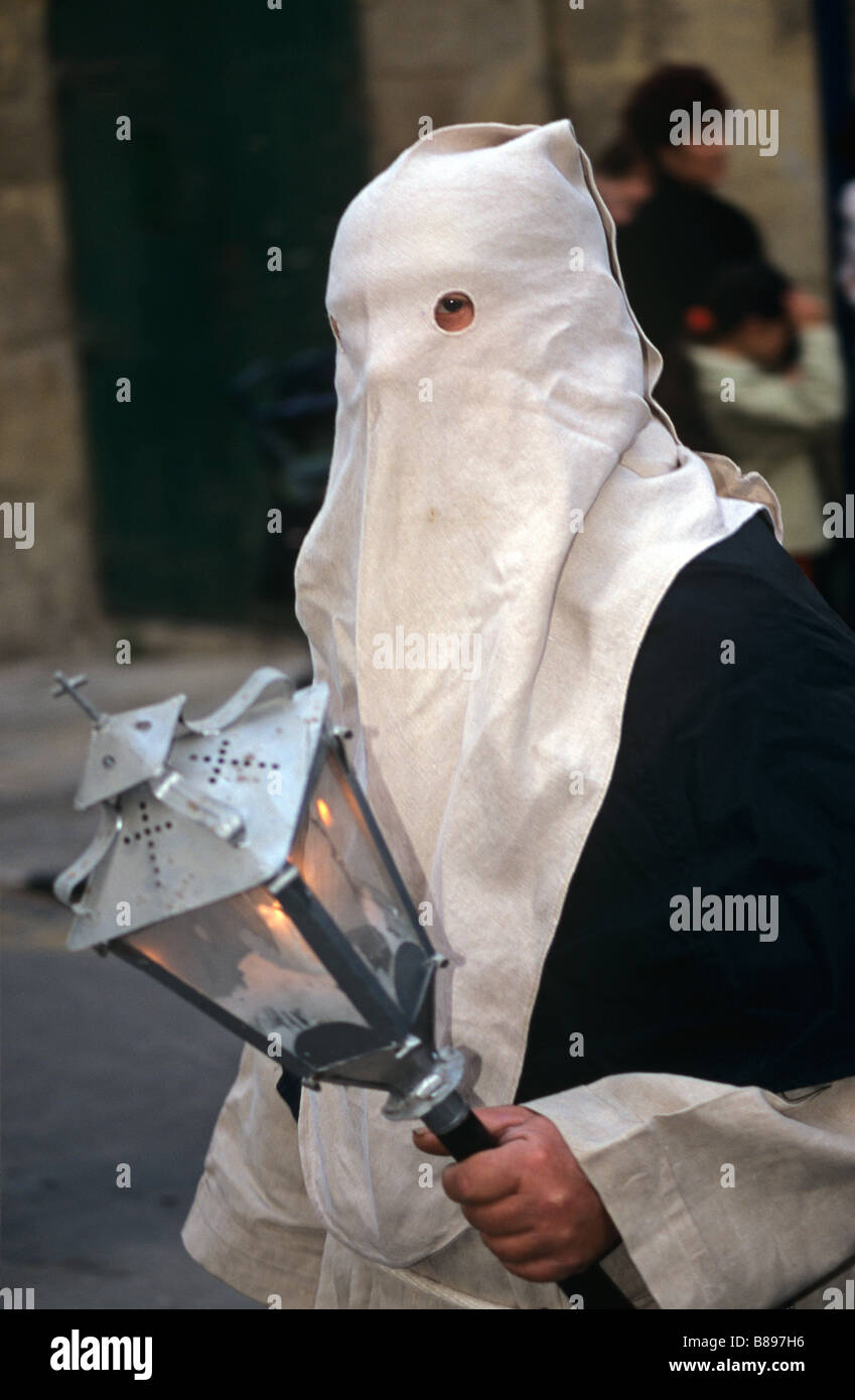 White Penitent & Lamp in Easter Parade or Holy Week Procession, Valletta, Malta Stock Photo