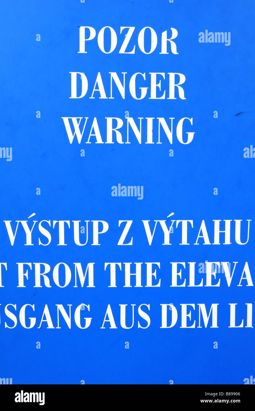 Warning sign in three languages Czech English and German Stock Photo