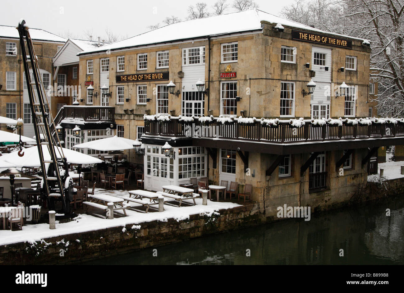 Oxford winter scene, 'Head of the River' pub building covered in snow next to the [River Thames], England, UK Stock Photo