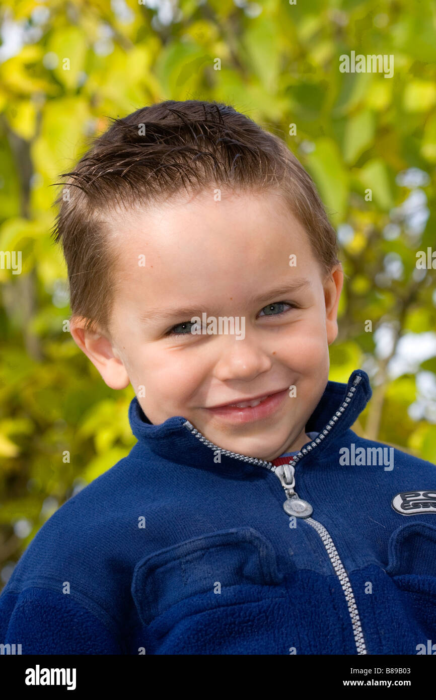 A cute wellgroomed boy with a smile Stock Photo Alamy