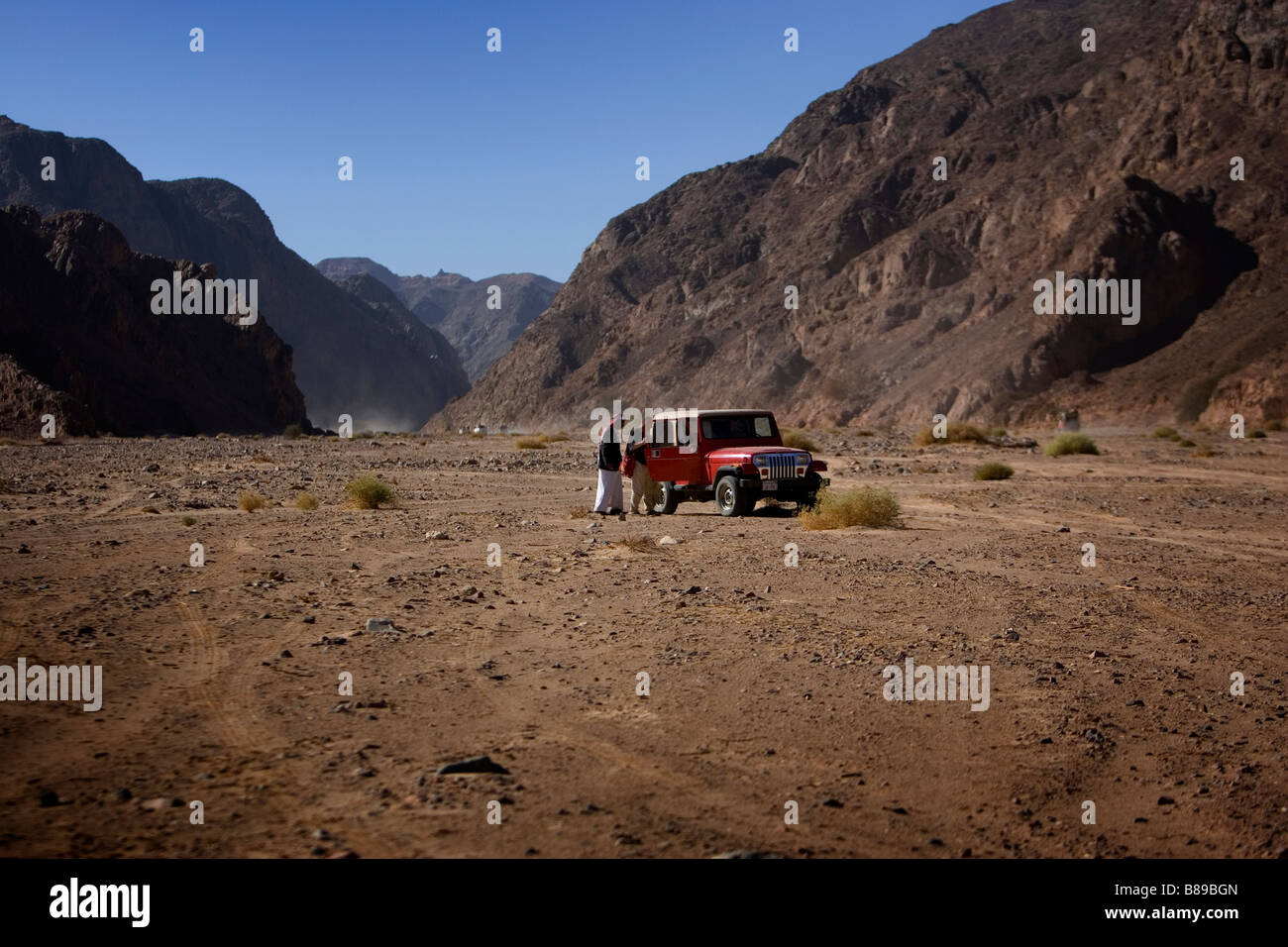 A red Jeep in the desert in Egypt Stock Photo Alamy