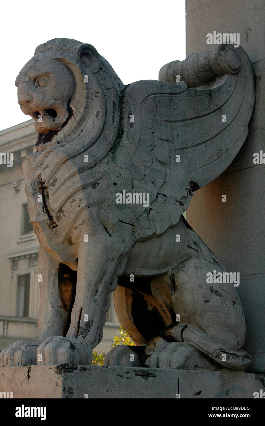 Winged lion stone concrete marble ferocious fangs art of thirties mane smog effects vertical Stock Photo