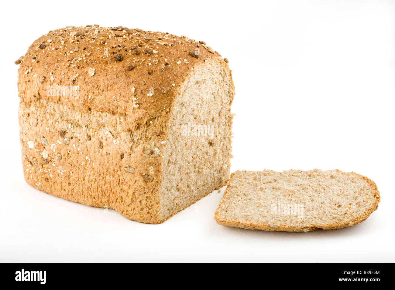 A loaf of wholemeal multigrain bread and slice Stock Photo Alamy