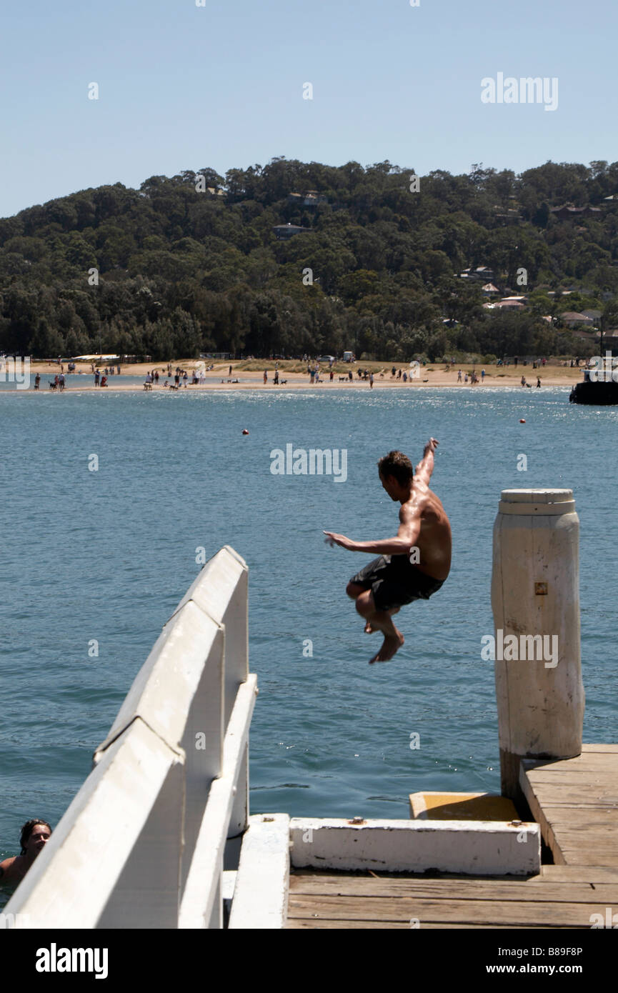 Boy jumping off pier hires stock photography and images Alamy