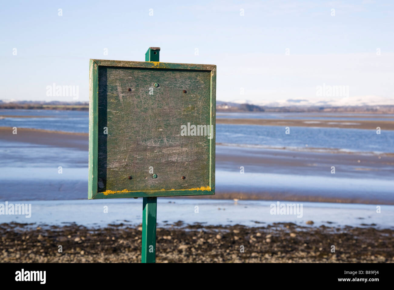 blank old wooden sign board on the waters edge. Montrose Basin, Angus, Scotland Stock Photo
