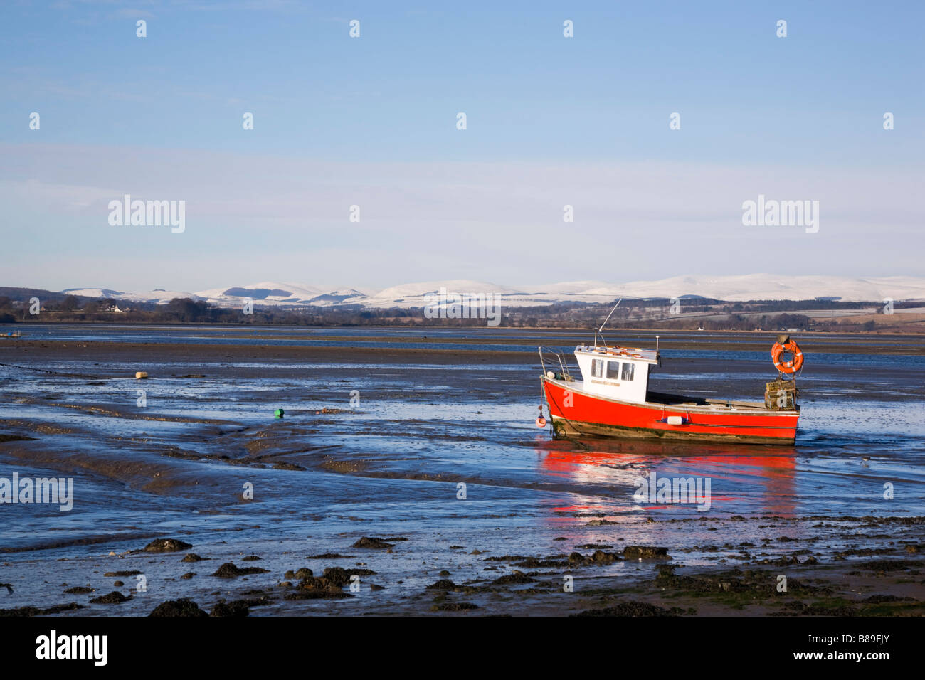 Boats in the mud at low tide, Montrose Basin, Angus, Scotland Stock Photo