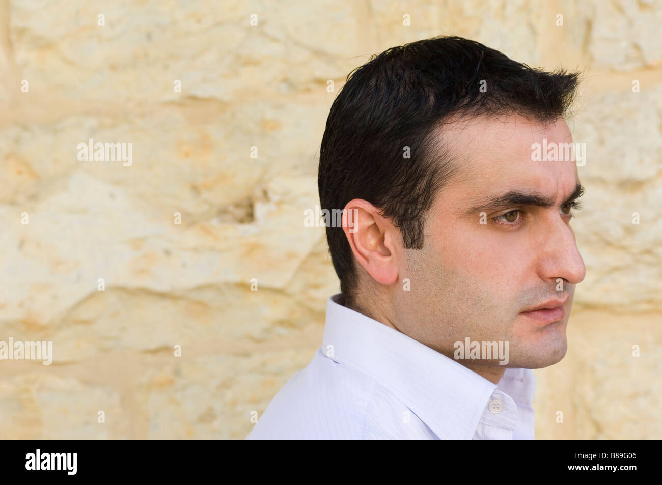 Portrait of a man looking away Stock Photo - Alamy