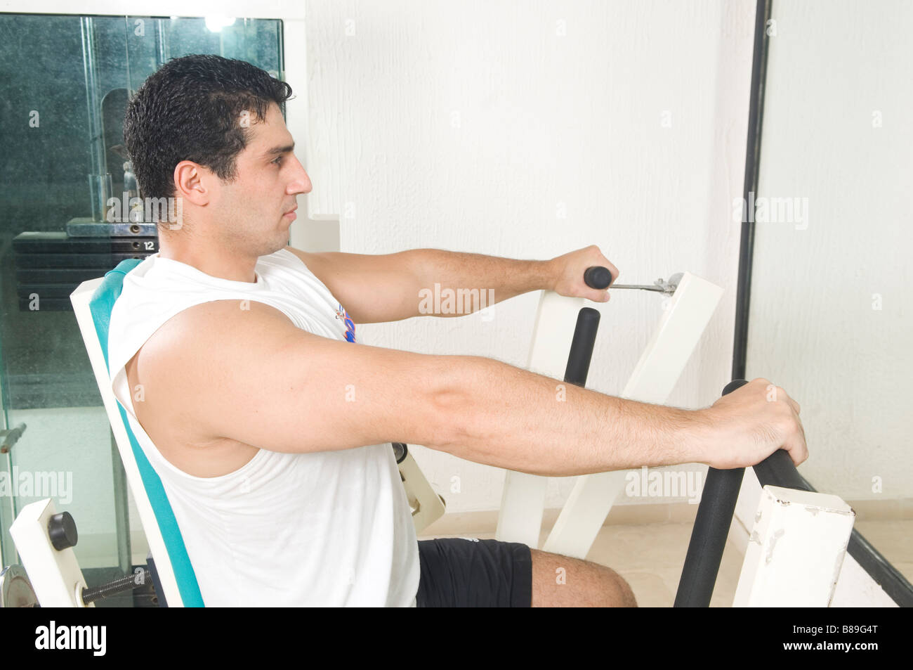 Man exercising in the gym Stock Photo