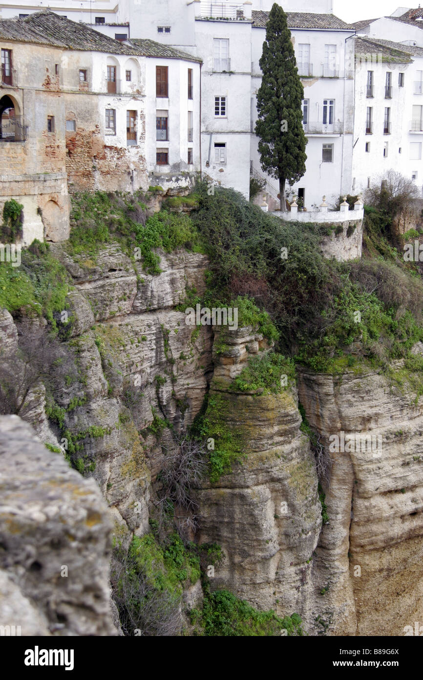 Old homes on the cliff edge in the town of Ronda Andalucia Spain Stock Photo