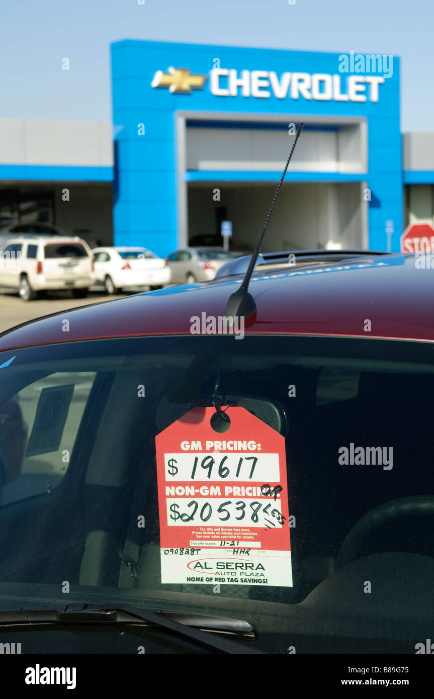Sale tag on a General Motors car at a dealership in Grand Blanc Michigan USA Stock Photo