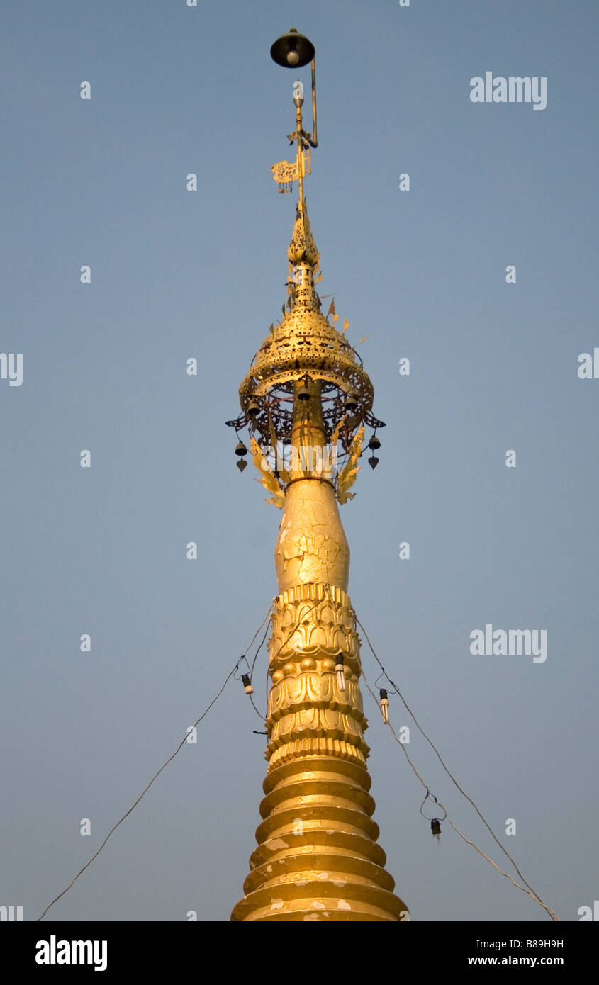 GOLD TEMPLE SPIRE FROM A TEMPLE IN SHAN STYLE TEMPLE IN SOPPONG, MAE HONG SONPROVINCE. Stock Photo