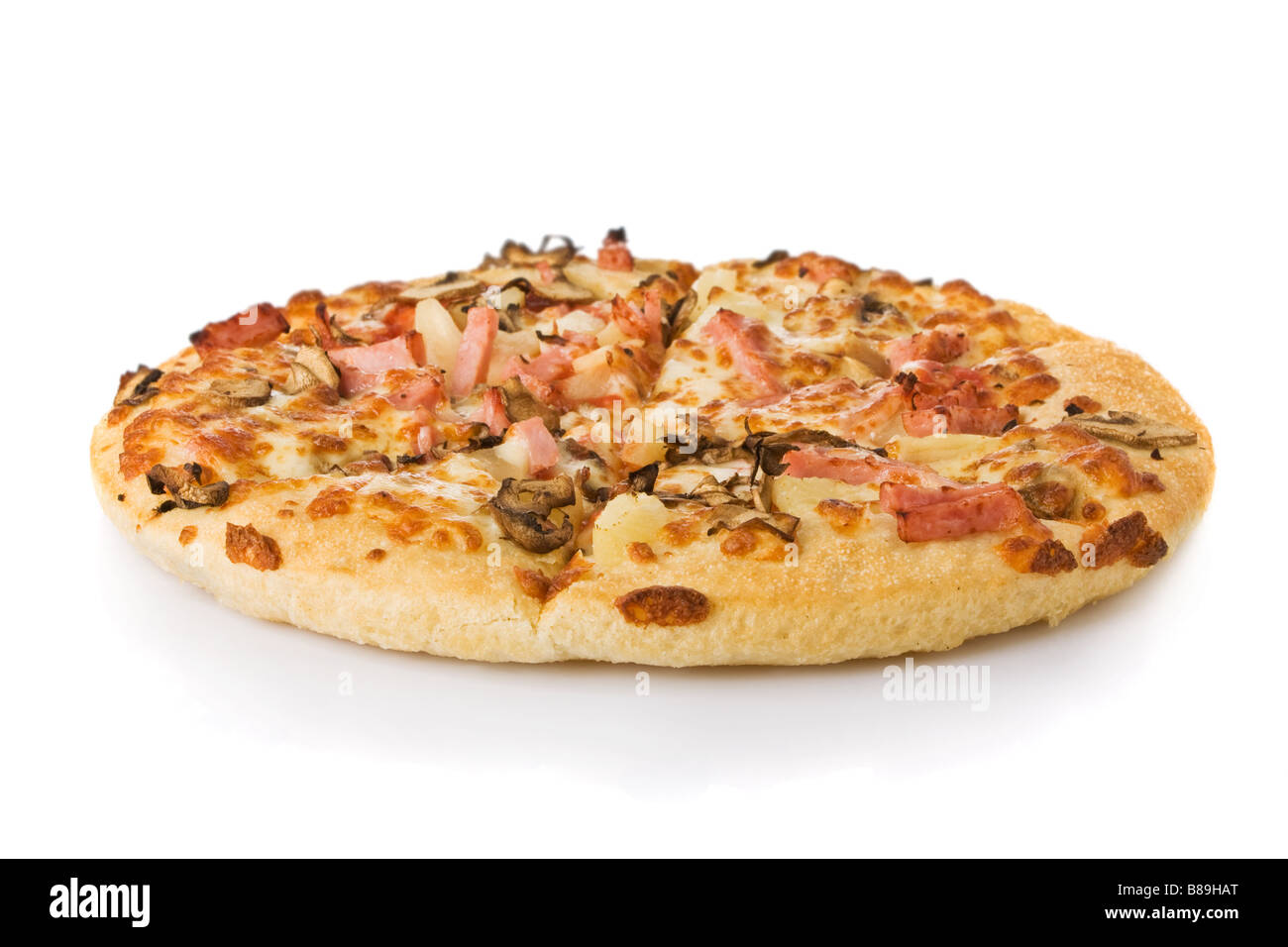 Pizza with mushrooms, ham and pineapple isolated on white Stock Photo