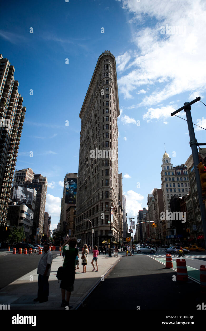 the flatiron building located at the intersection of fifth avenue and