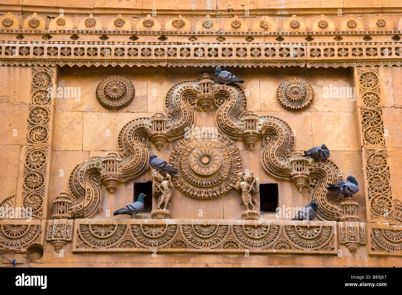 Decorative carving design in yellow stone architecture Jaisalmer Rajasthan India Stock Photo