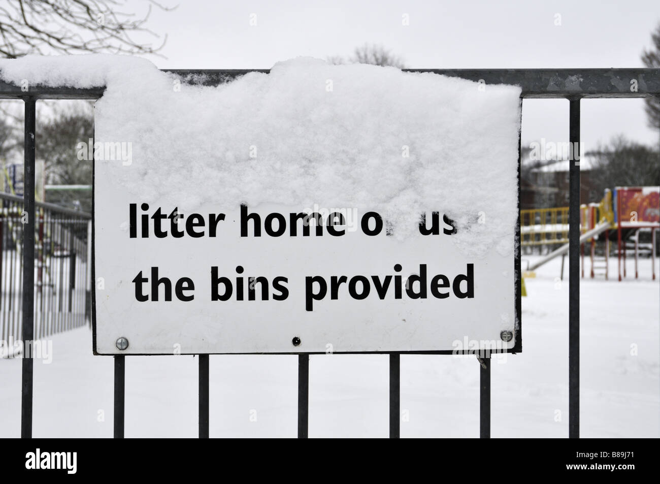 Snow covered litter sign UK Stock Photo Alamy