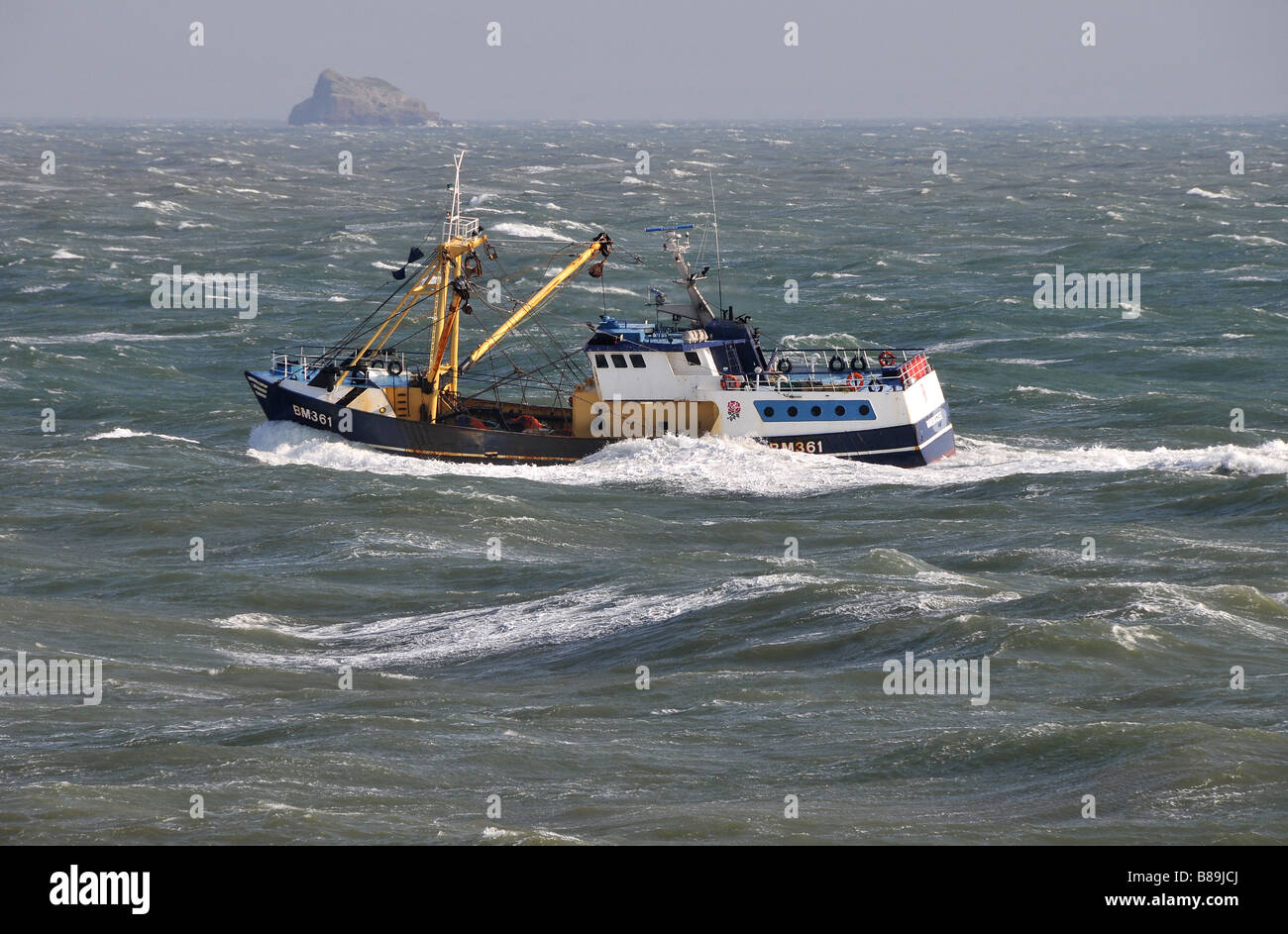 Brixham fishing trawler heading home across Torbay in a storm Stock Photo