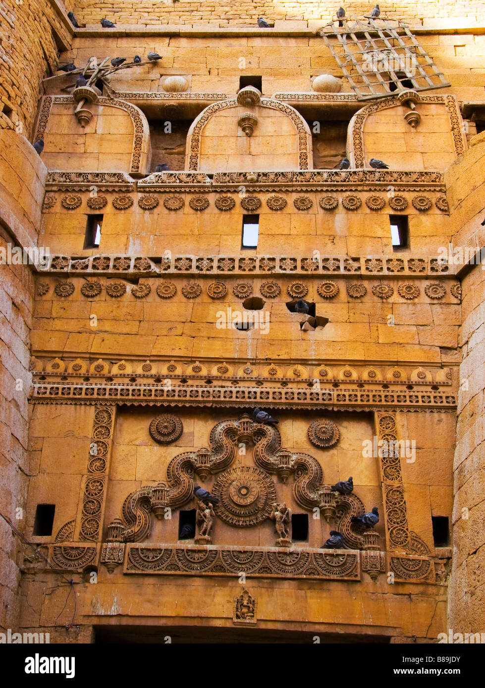 Decorative carving design in yellow stone architecture Jaisalmer Rajasthan India Stock Photo