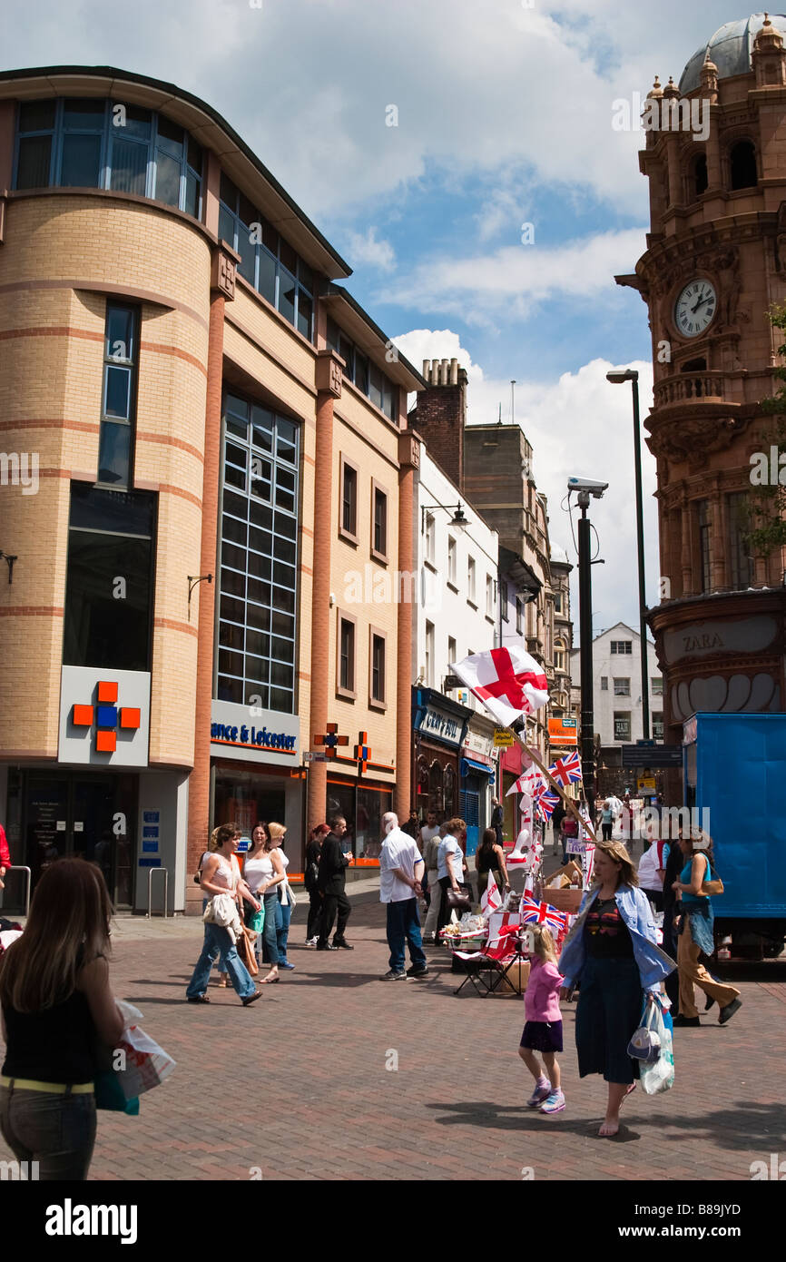 View of market stall holder in Nottingham selling football souvenirs