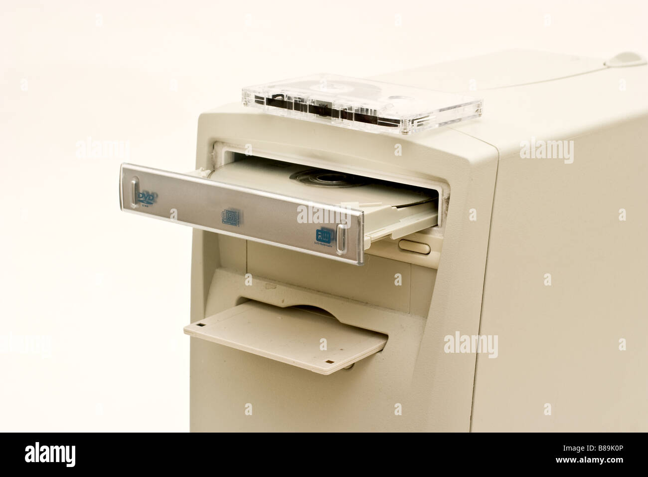 Old tan computer with diskette, cd and tape in drives Stock Photo