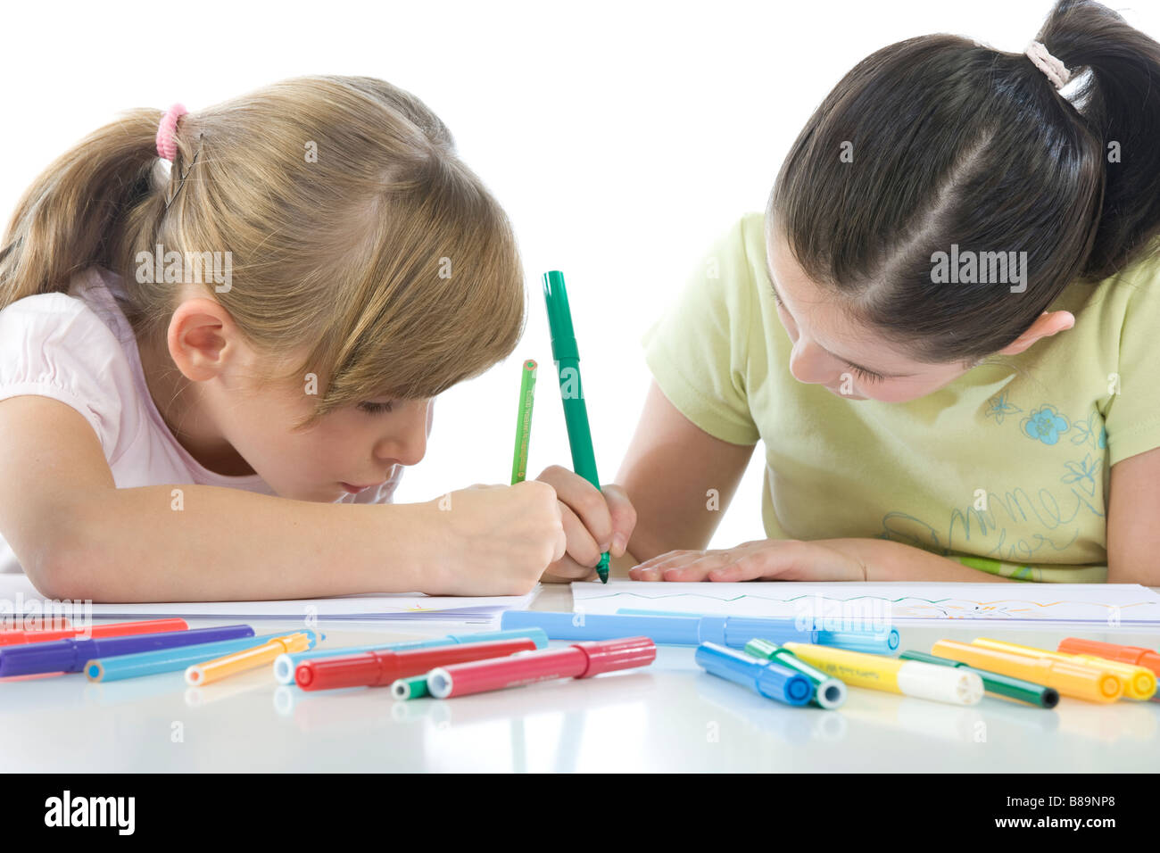 Portrait of smiling schoolchildren draws a picture Stock Photo - Alamy