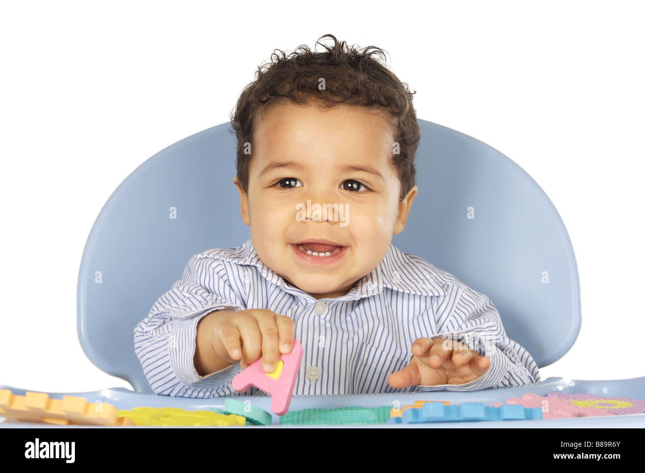 Baby learn letters playing a over white background Stock Photo Alamy