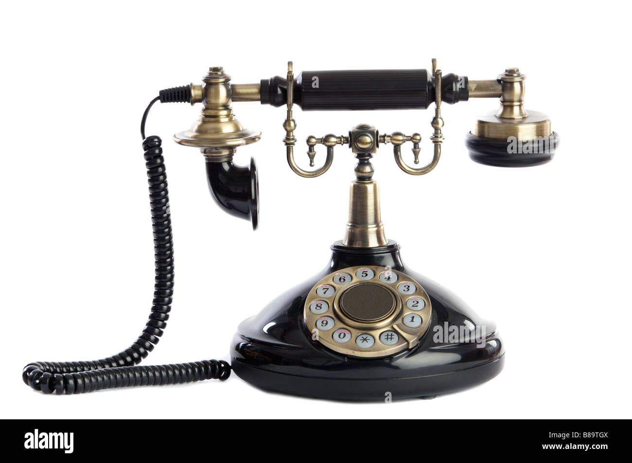 Old vintage black phone a over white background Stock Photo Alamy