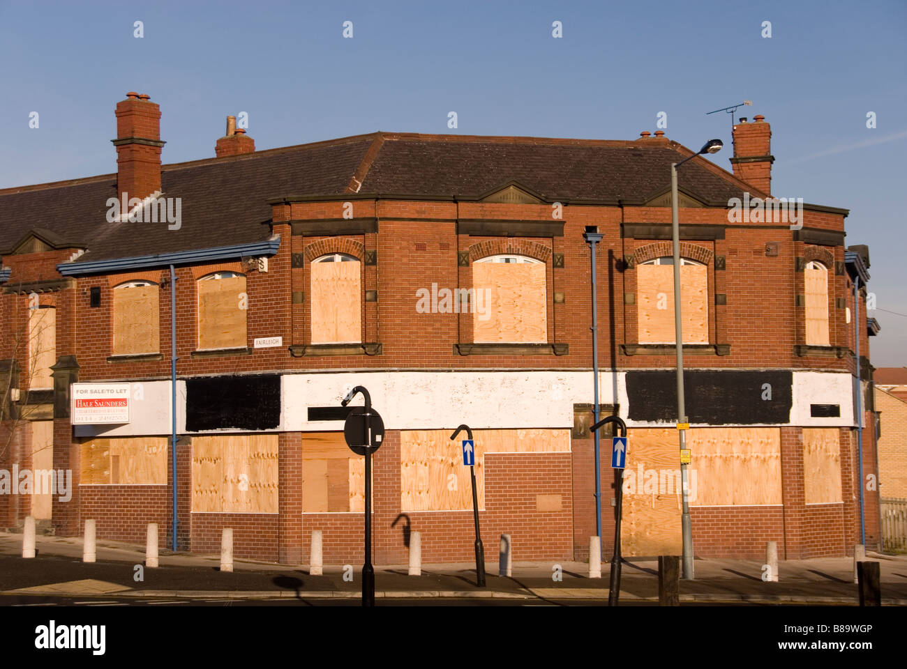 Boarded Up Windows in Empty Large Corner Business Property For Sale