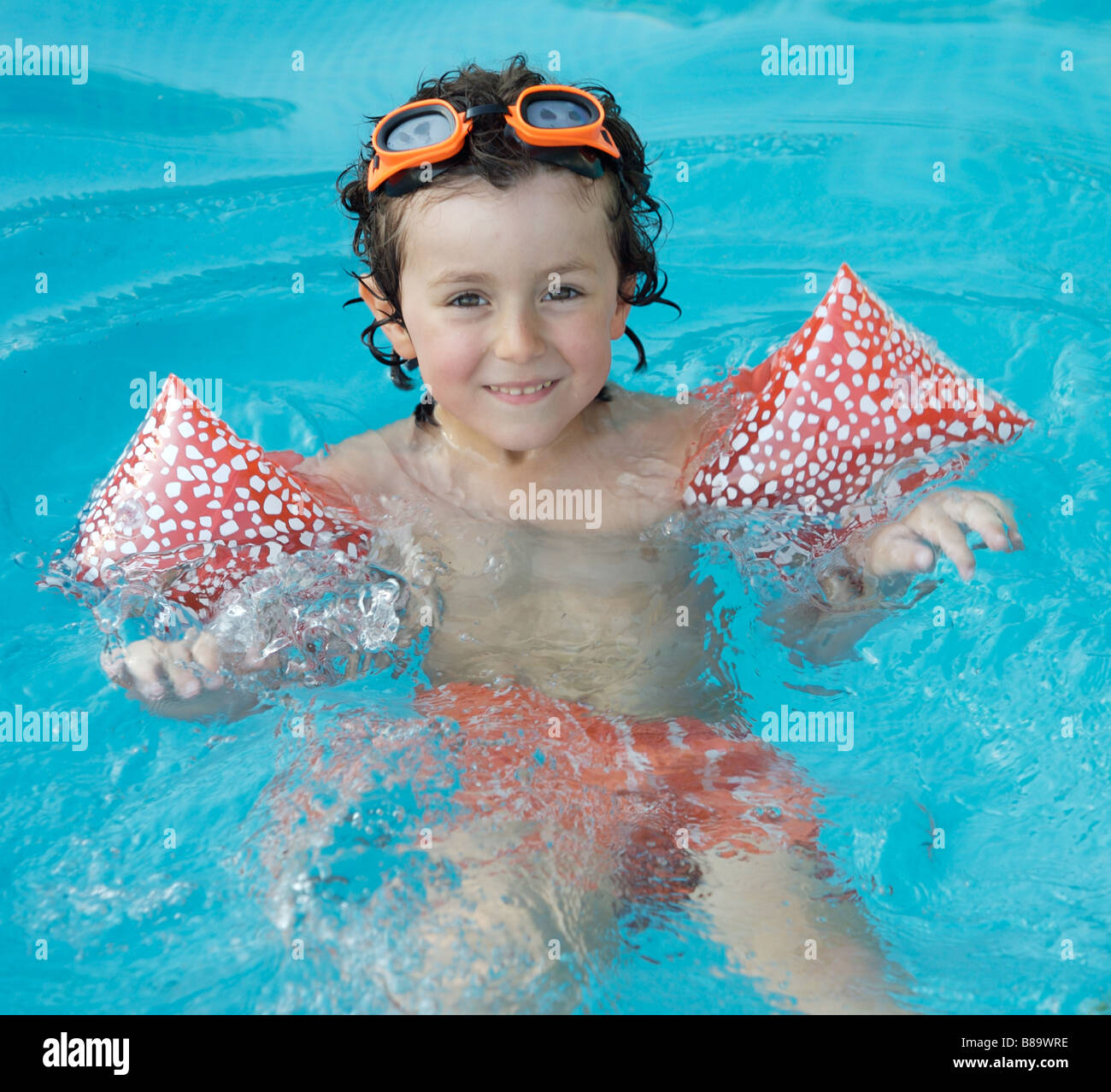 photo of an adorable boy learning to swim Stock Photo Alamy