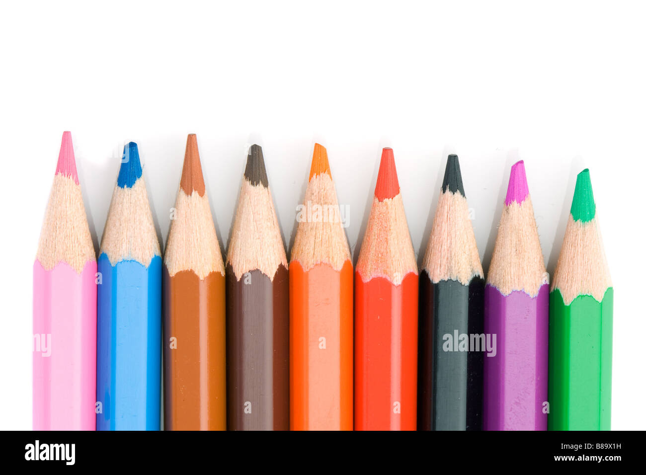 Colored pencils lined up on a white background Stock Photo Alamy
